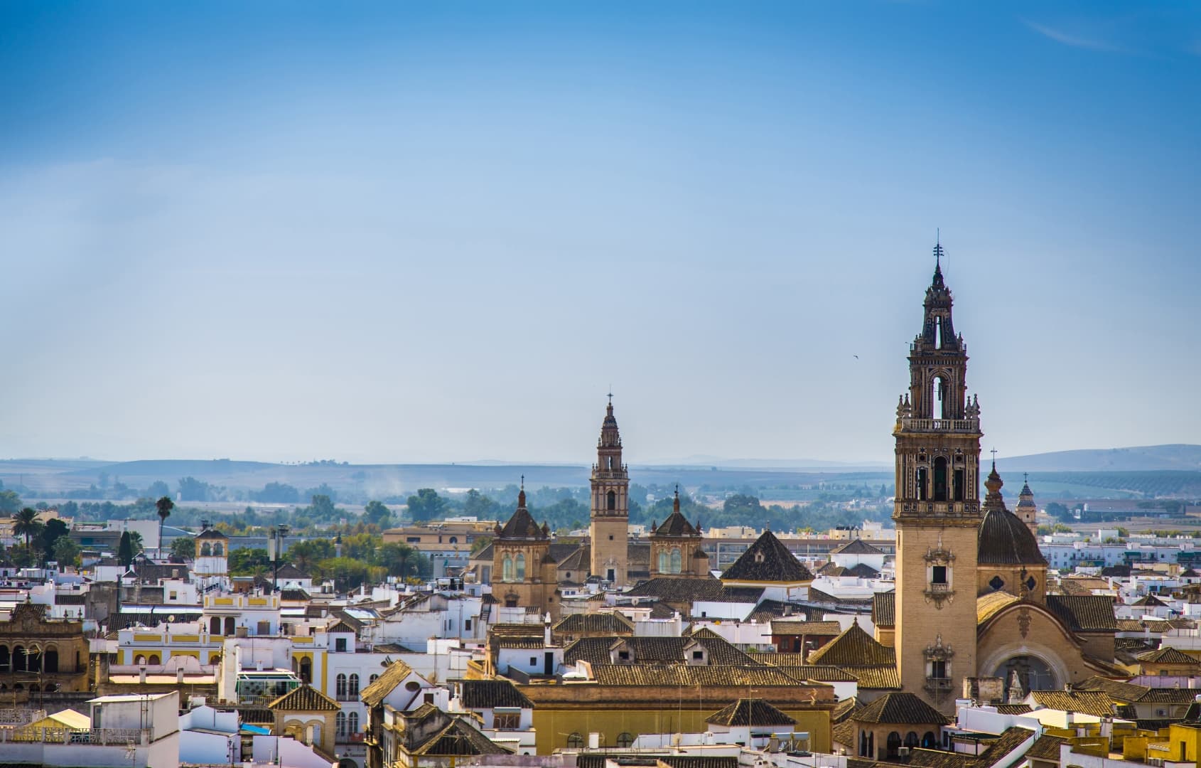 A panoramic view of Écija showcasing its iconic towers and beautiful architecture in Andalusia.